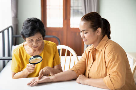 old woman fortune teller doing fortune tellingの写真素材