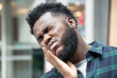 African man suffering from prostate cancer, sick African black man with prostate cancer, premature ejaculation, fertility, bladder problem, health care, cancer sickness conceptの写真素材