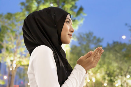 Southeast asian muslim woman in evening prayer, concept of Islamic people during Ramadan fasting,...