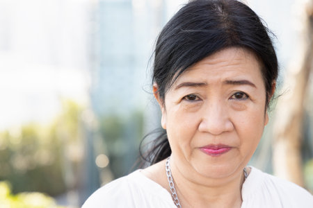 Healthy vaccinated old asian senior woman smiling with happinessの写真素材