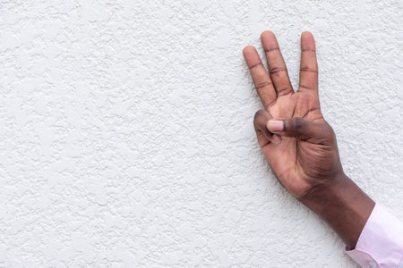 black man hand flipping middle finger, rude and offensive hand gesture
