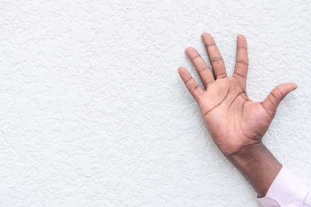 black man hand flipping middle finger, rude and offensive hand gestureの写真素材