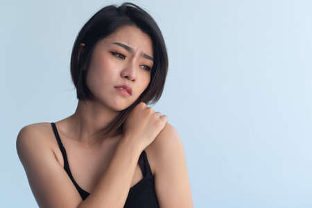 Asian woman having shoulder pain, office syndromeの写真素材