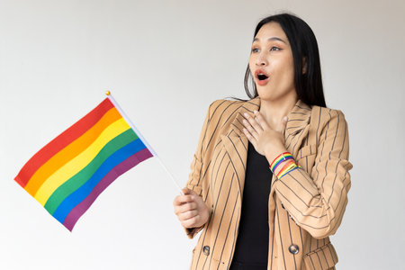 Excited non-binary LGBT person showing surprised expression for LGBT awareness pride monthの写真素材