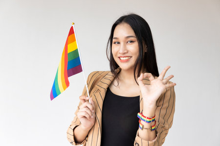 v Non-binary LGBT person showing good accepting ok hand sign for LGBT awareness pride monthの写真素材