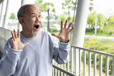 Negatively excited and surprised old asian senior manの写真素材