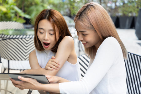 Skilled and experienced personal financial advisor worker presenting a good and convincing deal offer to her interesting clientの写真素材