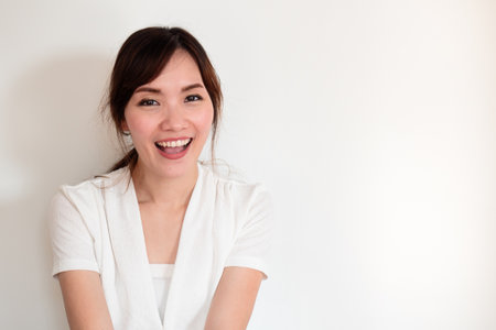happy laughing young asian womanの写真素材