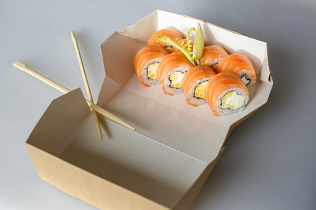 sushi set, Japanese, ginger and wasabi, in a box, on white background with chopsticksの写真素材