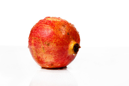 Ripe pomegranate fruit isolated on white background cutout, fresh garnetの写真素材