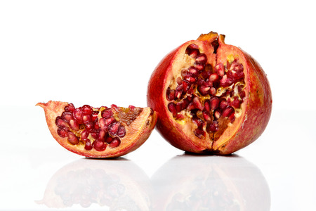 Ripe pomegranate fruit isolated on white background cutout, fresh garnetの写真素材