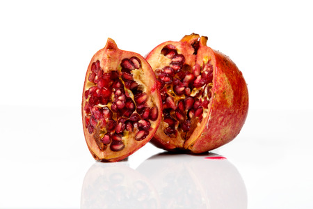 Ripe pomegranate fruit isolated on white background cutout, fresh garnetの写真素材
