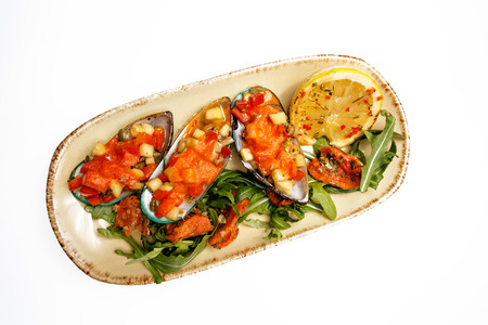 mix of mollusk, dish with mussels and salad, isolated in white backgroundの写真素材