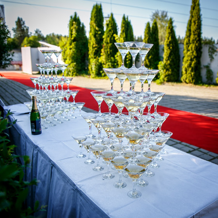 pyramid from glasses of champagne on event partyの写真素材