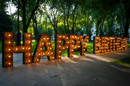 BIRTHDAY word with glowing light bulbsの写真素材
