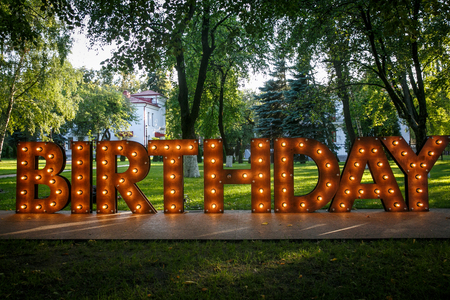 BIRTHDAY word with glowing light bulbsの写真素材