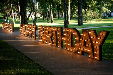 BIRTHDAY word with glowing light bulbsの写真素材