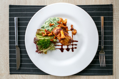 Fillet of beef or pork steak with mushrooms and sauce with chanterellesの写真素材