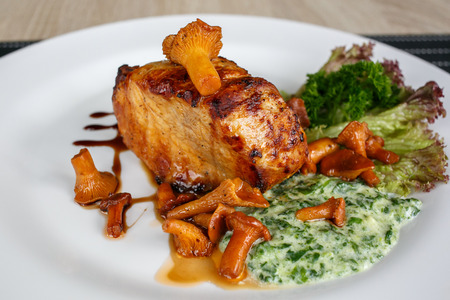 Fillet of beef or pork steak with mushrooms and sauce with chanterellesの写真素材