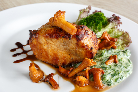 Fillet of beef or pork steak with mushrooms and sauce with chanterellesの写真素材