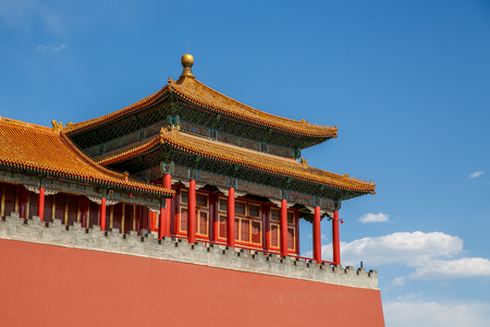 Traditional Chinese architectural roof, with animals. Immortal and beasts on the roof slope. Authentic China city, The yellow roof tiles with dragonの写真素材