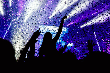 Black silhouette of people on rock concertの写真素材