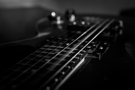 closeup shot of guitar string rattle, selective focus, Moment of extract music, black and whiteの写真素材