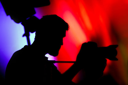 The Cameraman, Silhouette of Man with Video Camera at eventの写真素材