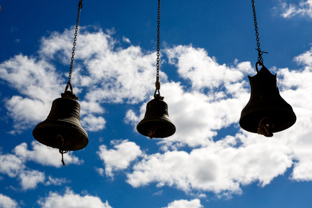 Orthodox bells closeup against the sky with clouds.の写真素材