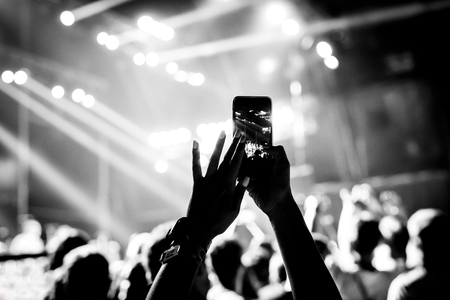 smartphone in the hands of women on the showの写真素材