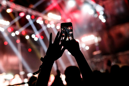 smartphone in the hands of women on the showの写真素材