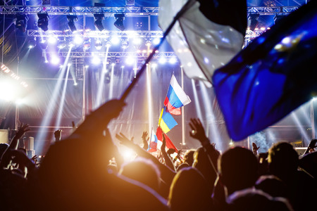 Russian flag at the concert, opposite the light from the stageの写真素材