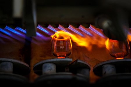 Glass blowing process, Manufacture of glassware, Someone is manufacturing glass products.の写真素材