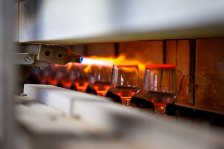 Glass blowing process, Manufacture of glassware, Someone is manufacturing glass products.の写真素材