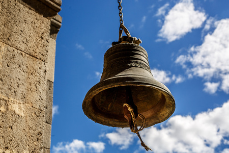 Orthodox bell closeup against the sky with clouds.の写真素材