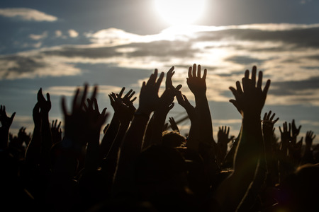 People silhouettes with raised up a human hands, Beach Party Summer Holiday Vacation Concept