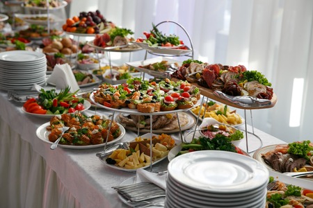 Catering service. Restaurant table with snacks food at event.の写真素材