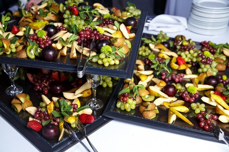 Slices of fruits on banquet table, event cateringの写真素材