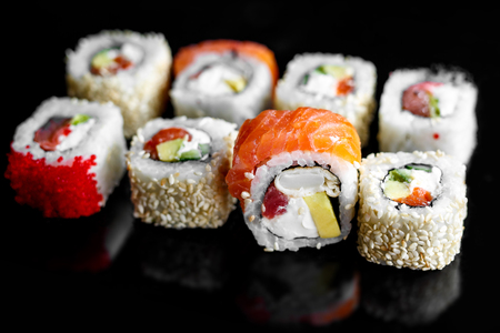 Rainbow Sushi Roll with salmon, eel, tuna, avocado, royal prawn, cream cheese Philadelphia, caviar tobica, chuka. Sushi menu Japanese foodの写真素材