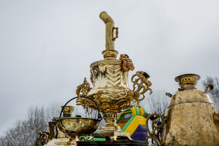 Traditional Russian Samovar, a metal container used to heat and boil water for tea ceremony. Outdoor. Gold editionの写真素材