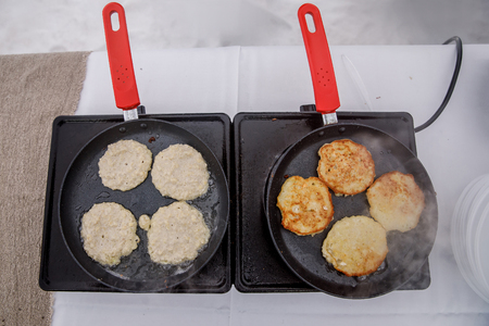 Potato pancakes fried in hot frying pan. Draniki.の写真素材