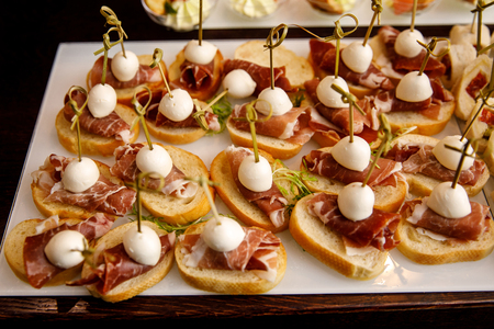 Dish of different appetizers snacks to beer.の写真素材