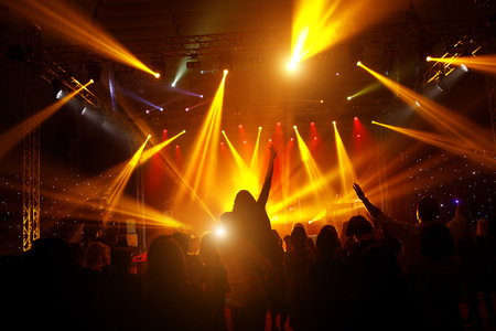 Black silhouette of people on rock concert.の写真素材