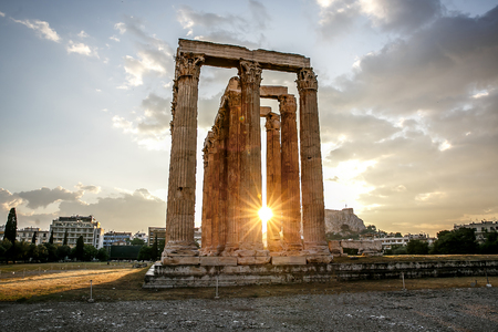 The ancient greek columns of Ancient Temple of Zeus, Olympeion, Athens, sunset light, backlight sunの写真素材