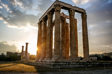 The ancient greek columns of Ancient Temple of Zeus, Olympeion, Athens, sunset light, backlight sunの写真素材