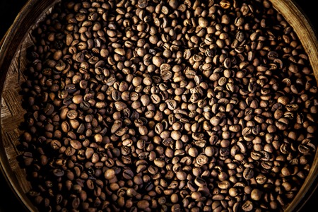 Luwak coffee beans In a round container. Top view. The legendary coffee from Bali, Indonesiaの写真素材