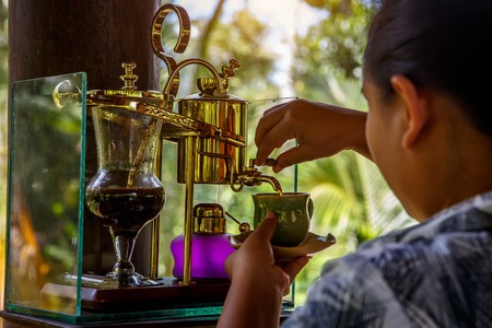 Making legendary coffee, Kopi Luwak, in a vintage siphon. Bali, Indonesiaの写真素材