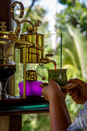 Making legendary coffee, Kopi Luwak, in a vintage siphon. Bali, Indonesiaの写真素材