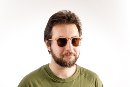 Advert portrait of a young man in sunglasses. Wary emotion, alertness on faceの写真素材