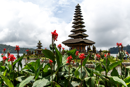 Balinese temple on the lake, flowers aroundの写真素材